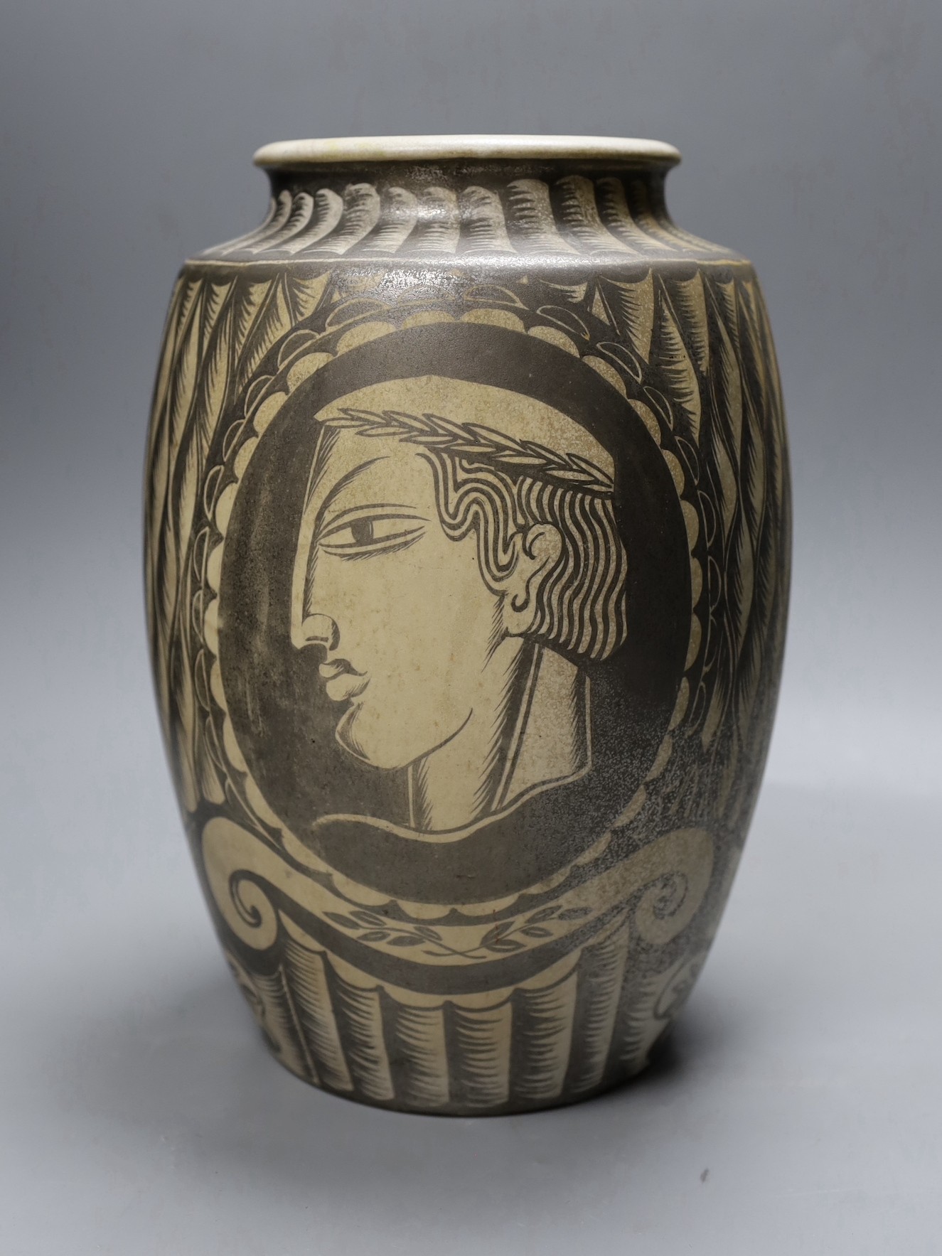 A possibly unique Royal Doulton Lambeth stoneware silver lustre vase, c.1936, painted with Greek style heads on a feather ground, inscribed ‘A*E*B 1936’, impressed marks to base, 30.5 cm high